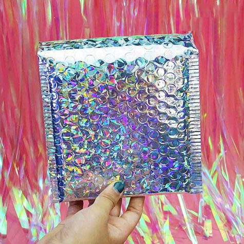 hand-holding-holographic-bubble-mailer