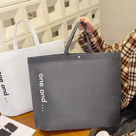 holding-charcoal-grey-non-woven-shopping-tote